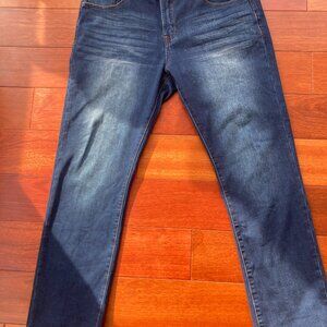 Never been worn, stretch distressed denim jeans by Genes Shop